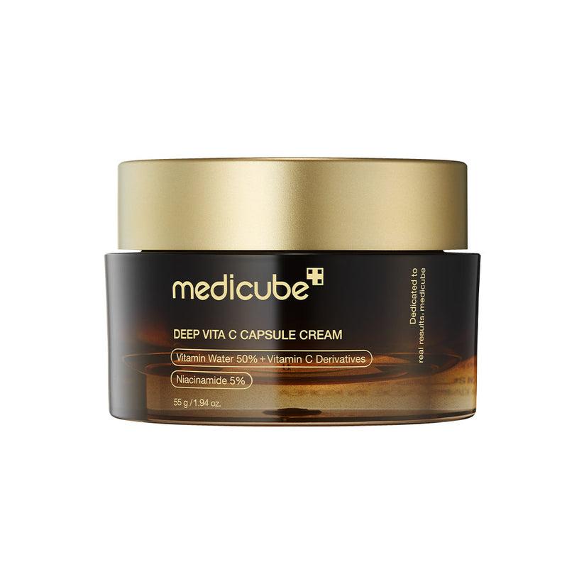 A jar of Medicube Deep Vita C Capsule Cream with a black and brown label, predominantly featuring the brand logo and product information.